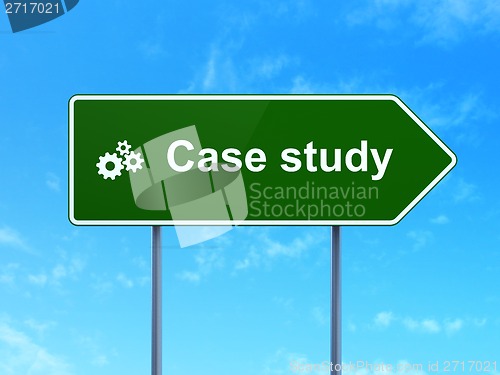 Image of Education concept: Case Study and Gears on road sign background