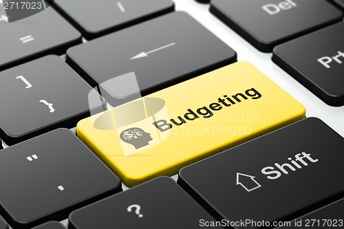 Image of Finance concept: Head With Finance Symbol and Budgeting on computer keyboard background