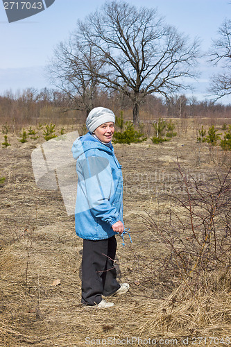 Image of One elderly woman in a spring forest