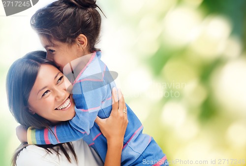 Image of hugging mother and daughter