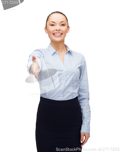 Image of businesswoman with opened hand ready for handshake