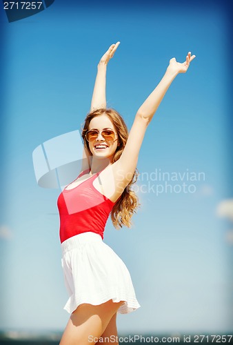 Image of girl standing on the beach