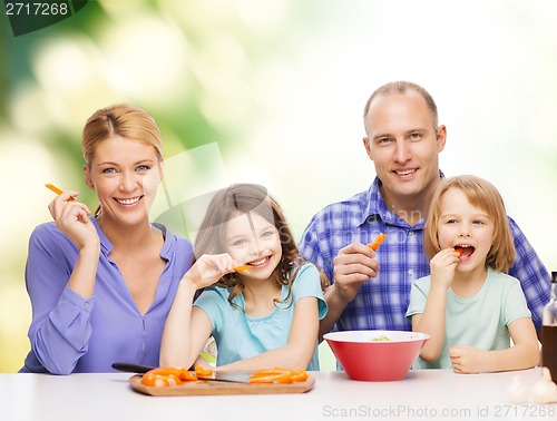 Image of happy family with two kids eating at home