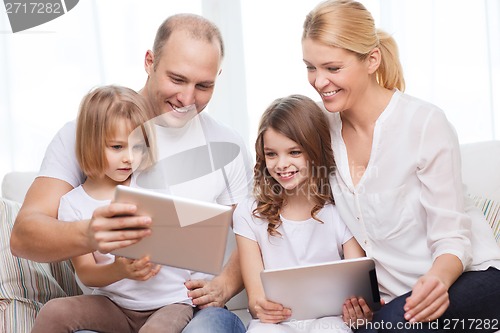 Image of family and two kids with tablet pc computers