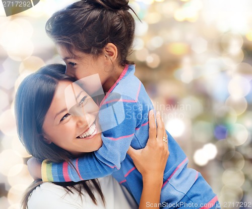 Image of hugging mother and daughter