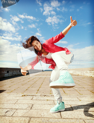 Image of beautiful dancing girl in movement
