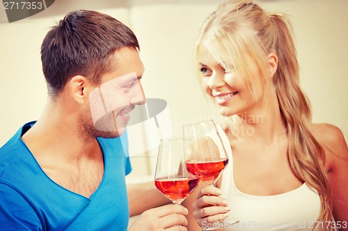 Image of romantic couple drinking wine