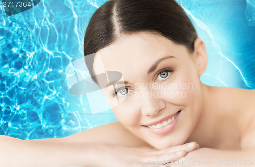 Image of smiling woman in spa salon