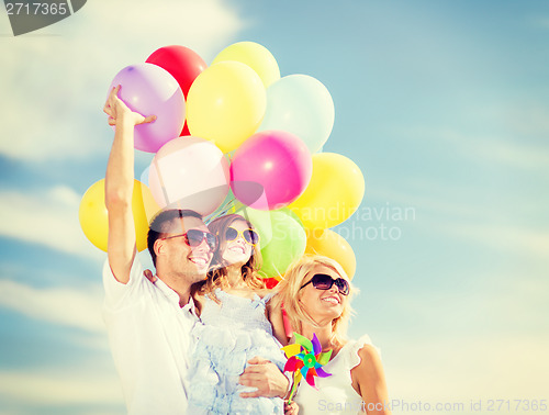 Image of family with colorful balloons