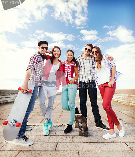 Image of teenagers with skates outside