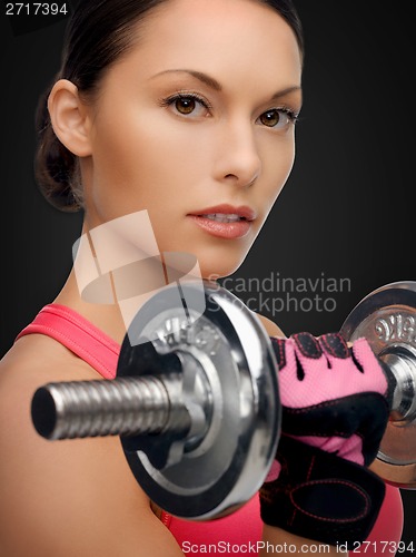 Image of asian sporty woman with heavy dumbbell