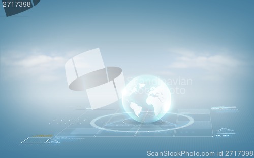 Image of globe hologram over blue background