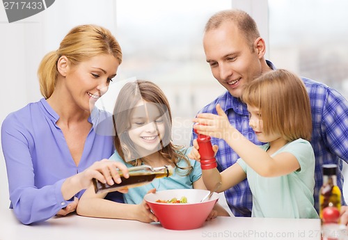 Image of happy family with two kids eating at home