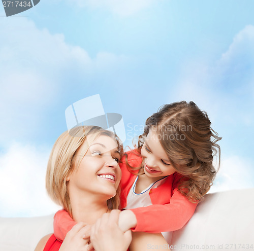 Image of hugging mother and daughter