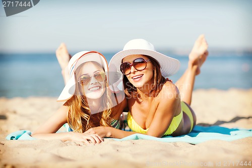 Image of girls sunbathing on the beach