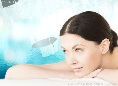 Image of smiling woman in spa salon