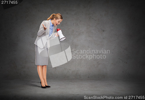 Image of angry businesswoman with megaphone