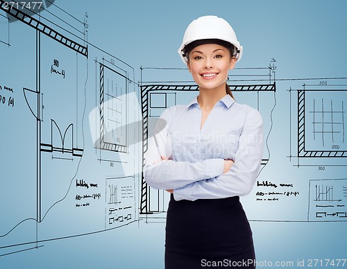 Image of friendly smiling businesswoman in white helmet