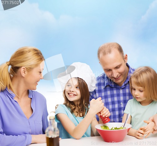 Image of happy family with two kids eating at home