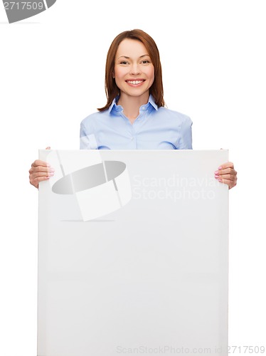 Image of smiling businesswoman with white blank board