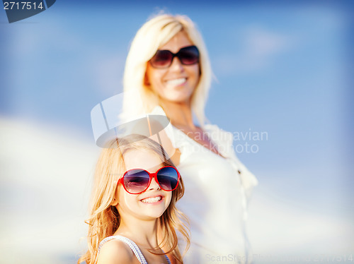 Image of mother and child in sunglasses