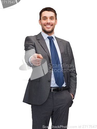 Image of handsome buisnessman pointing finger at you