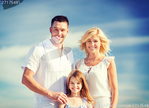 Image of happy family with blue sky