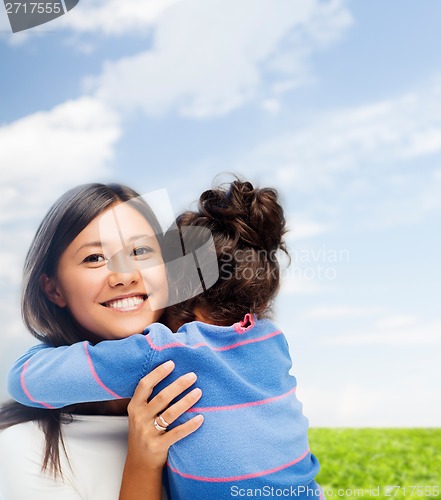Image of hugging mother and daughter