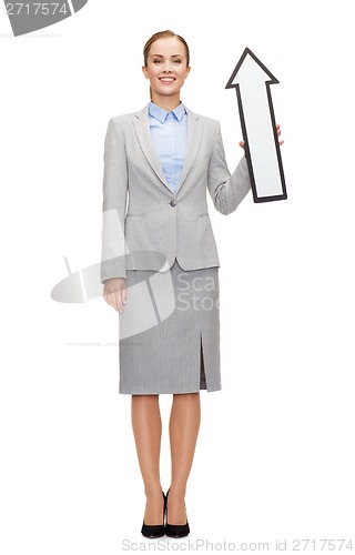 Image of smiling businesswoman with direction arrow sign