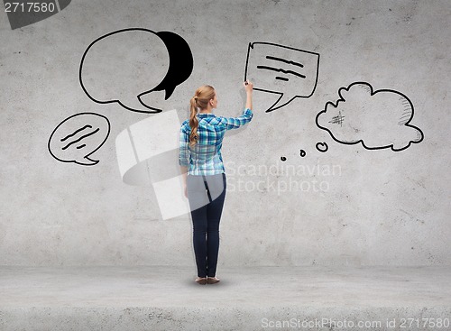 Image of smiling young woman writing on virtual screen