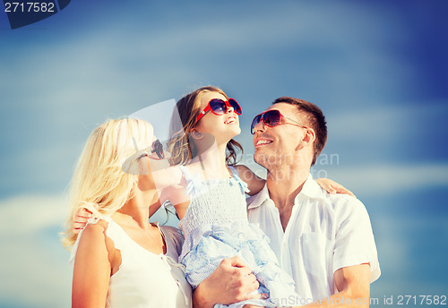 Image of happy family with blue sky