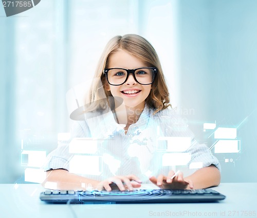 Image of student girl with keyboard and virtual screen