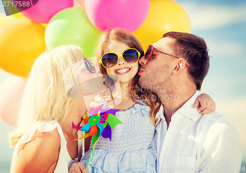 Image of family with colorful balloons