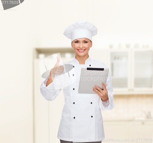 Image of smiling female chef with tablet pc computer