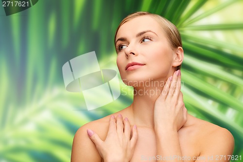 Image of face and hands of beautiful woman