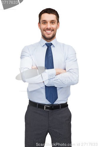 Image of handsome buisnessman with crossed arms