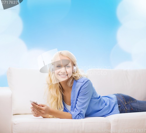 Image of woman with smartphone and headphones