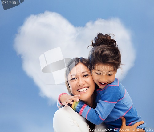 Image of hugging mother and daughter