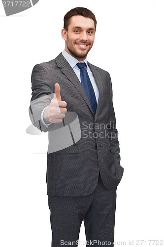 Image of handsome buisnessman showing thumbs up