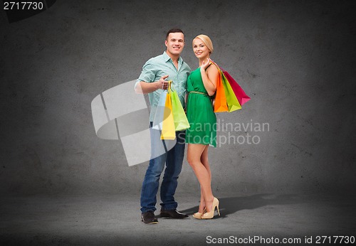 Image of smiling couple with shopping bags