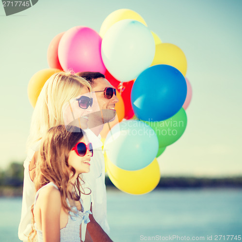 Image of family with colorful balloons