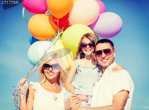 Image of family with colorful balloons