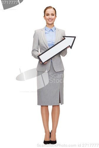 Image of smiling businesswoman with direction arrow sign