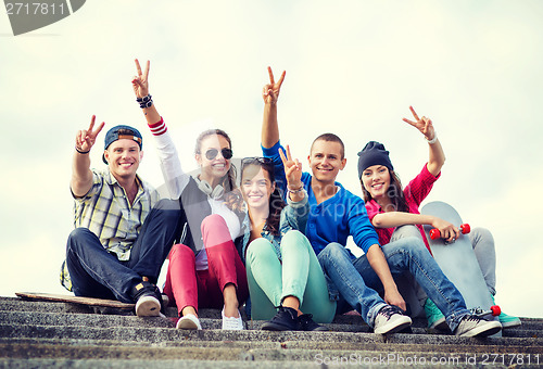 Image of group of teenagers showing finger five