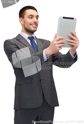 Image of smiling buisnessman with tablet pc computer