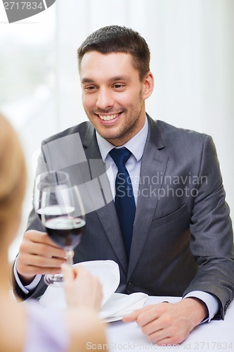 Image of young man looking at girlfriend or wife