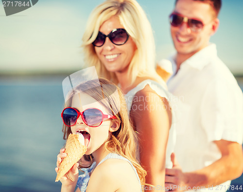 Image of happy family eating ice cream