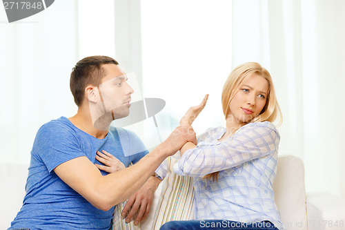 Image of unhappy couple having argument at home