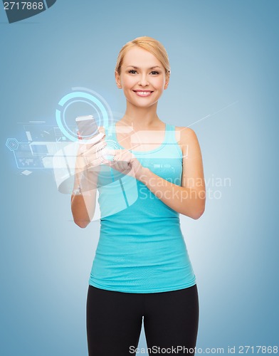 Image of sporty woman with smartphone