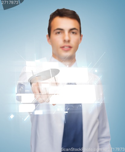 Image of buisnessman pointing finger to virtual screen